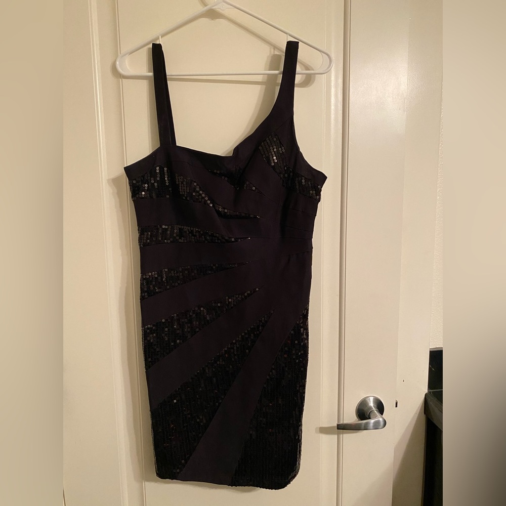 Little black cocktail dress. Size L. Black sequin embellishment. One shoulder.